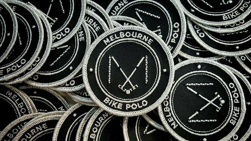 a stack of Melbourne bike polo patches