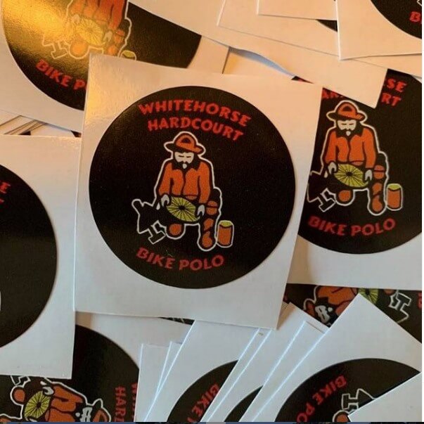 a stack of Whitehorse Bike Polo Club stickers